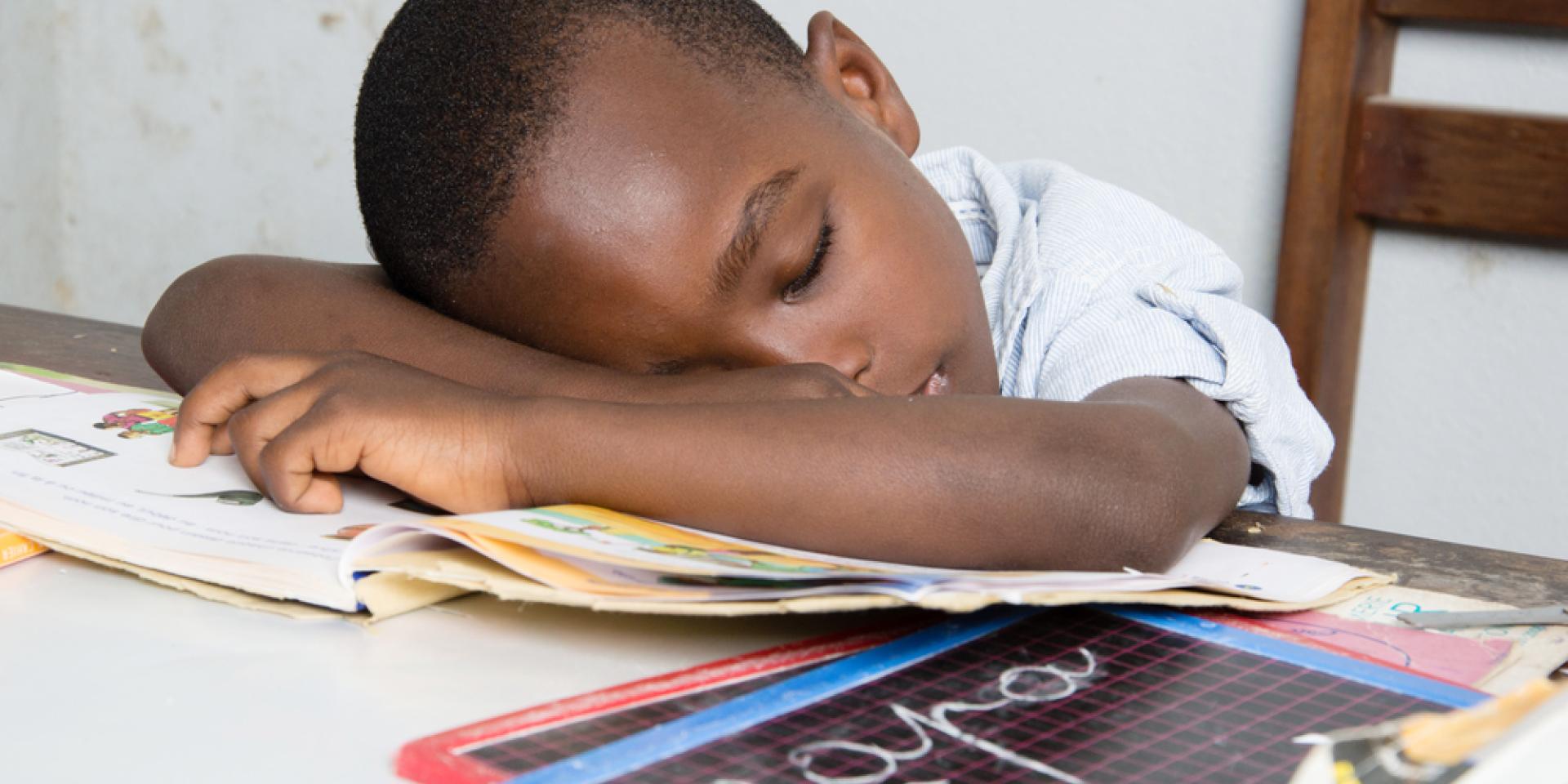 child sleeping on work