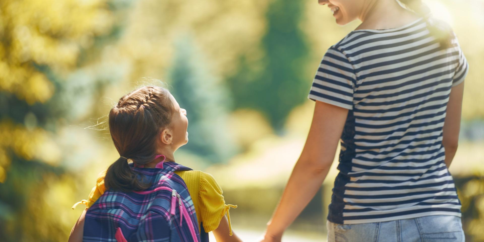holding hands going to school