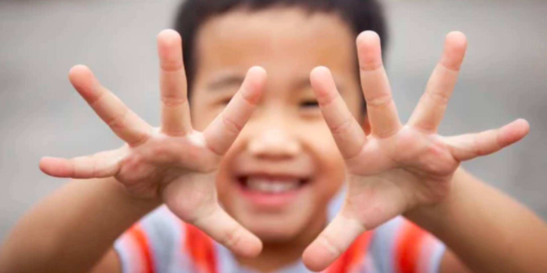 kid showing 10 fingers