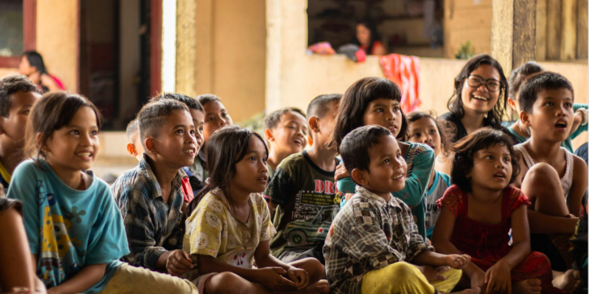 children sitting listening