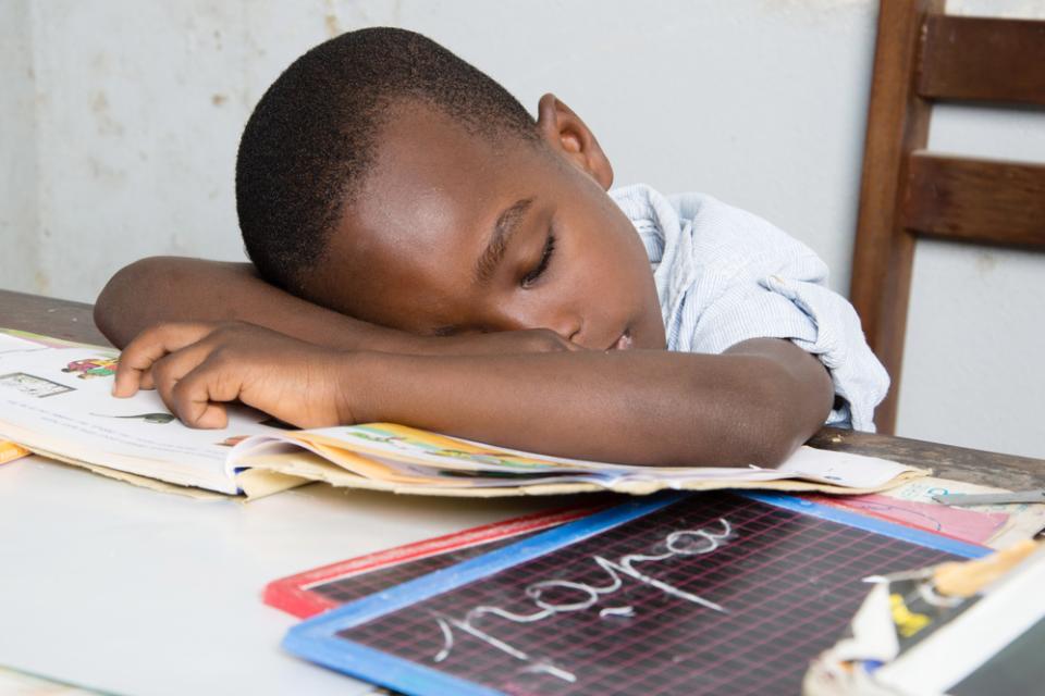 child sleeping on work