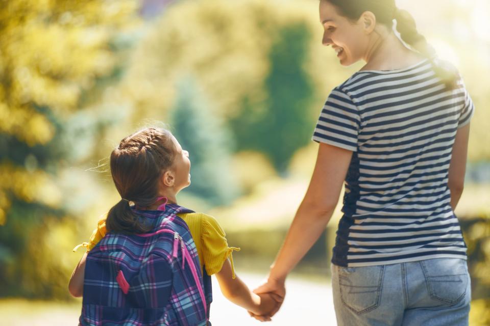 holding hands going to school