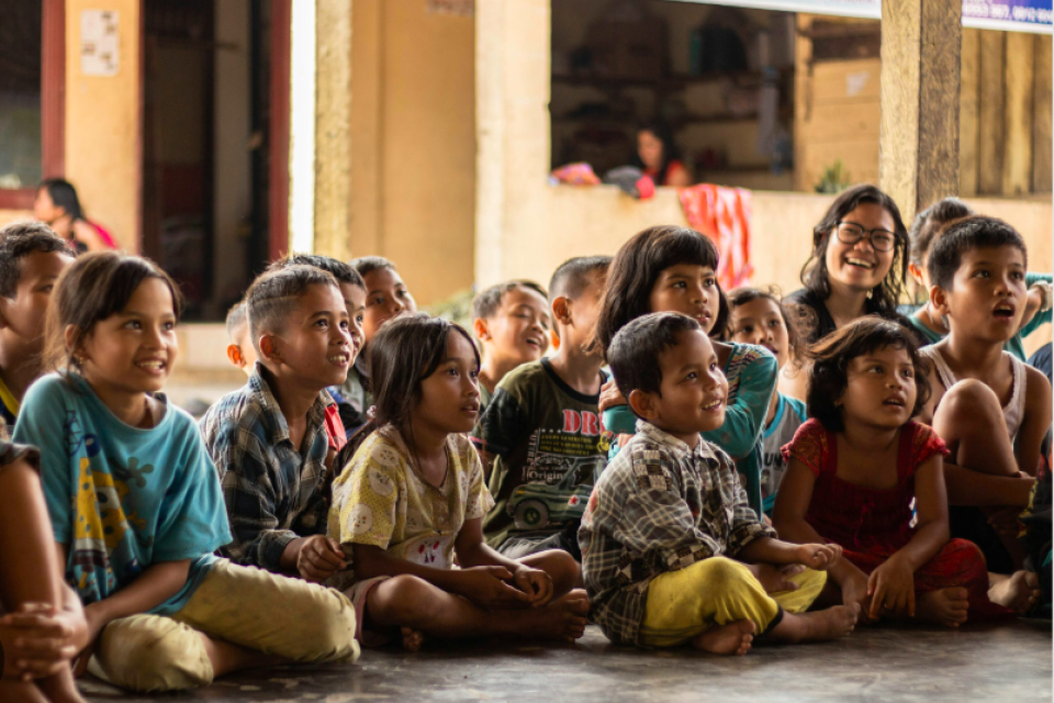 children sitting listening